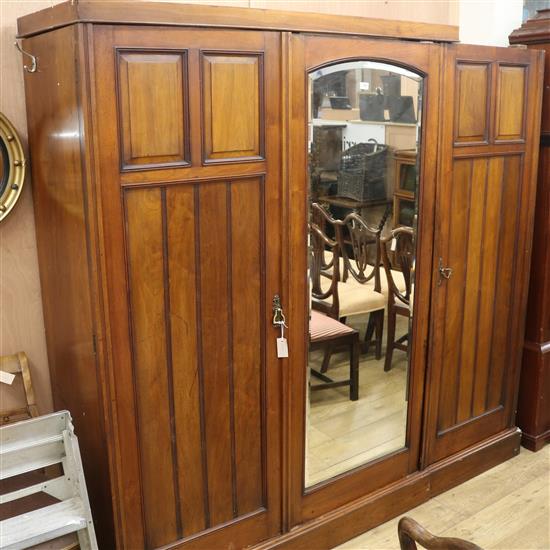 A mahogany triple wardrobe, W.210cm